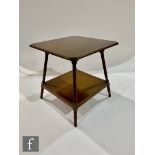 Unknown ? An Aesthetic movement mahogany two tier canted square table with turned shaped legs,