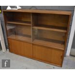 Robert Heritage - For Beaver & Tapley - A 1960s teak and glass book case with twin glazed doors