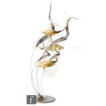 Unknown - A contemporary abstract polished steel and brass sculpture, formed as three stylised