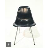 Charles and Ray Eames - Herman Miller - A blue fibreglass DSX chair, on chromium plated legs,