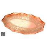 In the manner of J & F Pool (Hayle) - An Arts and Crafts copper tray of oval form with a wavy edge