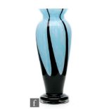 Unknown - A Czechoslovakian glass vase of footed ovoid form with flared rim, the mottled pale blue