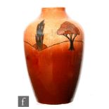 Ault - An early 20th Century shouldered vase decorated with tubelined trees against a tonal brown