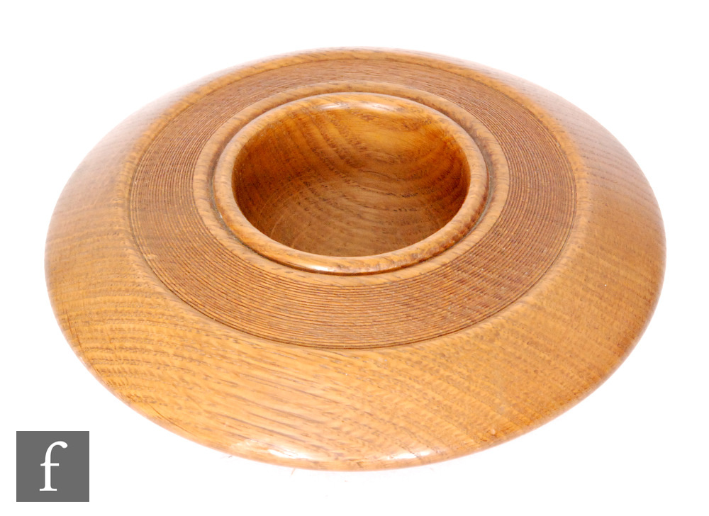 Mike Scott (Chai) - A later 20th Century oak wood turned bowl of circular section with wide rim, the