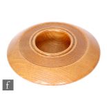 Mike Scott (Chai) - A later 20th Century oak wood turned bowl of circular section with wide rim, the