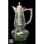 Richardson's - A late 19th Century clear crystal claret jug, of gourd form with green and white