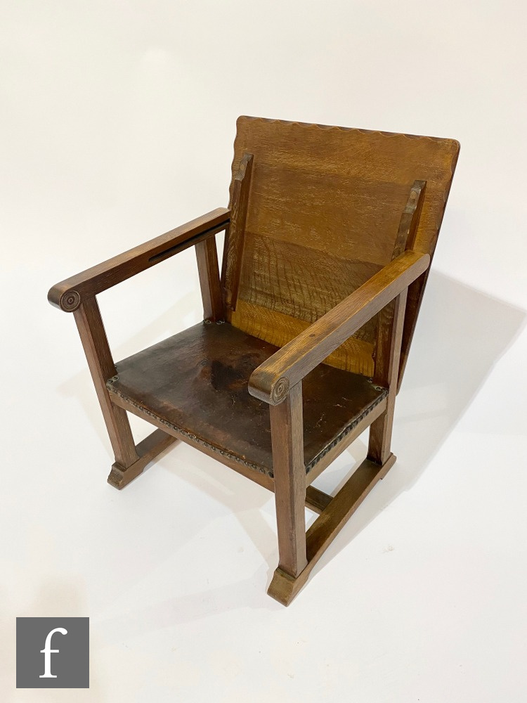 Unknown ? An Arts and Crafts oak metamorphic monks chair with leather seat folding into a table,