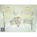 Rodney Kinsman - OMK - A pair of ?Omkstak? white powder coated steel stacking chairs, with pierced