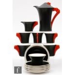 Clarice Cliff - Yoo Hoo - A Daffodil shape coffee set circa 1936, decorated with matt black body and