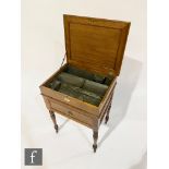 Unknown ? An oak artists cabinet with hinged lid opening to fitted tin compartmental interior