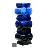 Lars Hellsten - Skruf - A post war glass owl vase in blue, of three tiers with alternating relief