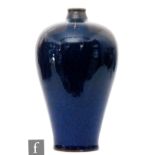 A Chinese blue glazed meiping vase, the shouldered base, rising from a tapered footring and