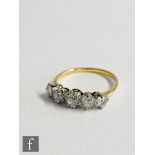 A mid 20th Century 18ct diamond five stone ring, claw set old cut stones to knife edged shoulders,