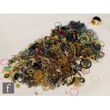 A large parcel lot of assorted modern costume jewellery to include beads, bangles, bracelets,