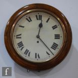 An early 20th Century wall clock with a beech bevelled surround and a spring driven movement,