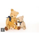 Two 1940s to 1950s British teddy bears, the first with golden mohair, amber and black plastic