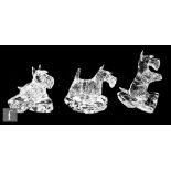 Three later 20th Century clear crystal stylised figures of Scottish Terriers by Ned Harris, one