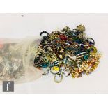 A large parcel lot of assorted modern costume jewellery to include beads, bangles, bracelets,