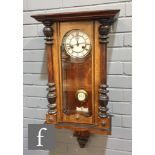 A late 19th Century spring driven walnut cased regulator wall clock, height 82cm