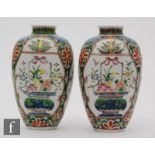 A pair of Chinese famille verte vases, of rounded ovoid form extending to a slight everted rim, with