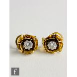 A pair of 18ct diamond stud earrings, brilliant cut claw set stones each approximately 0.50ct within