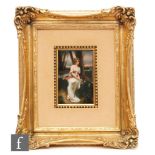 An early 20th Century framed rectangular porcelain plaque hand painted with a young lady holding