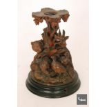 A 19th Century Black Forest carving of a fox and three grouse to a naturalistic ground, all to a