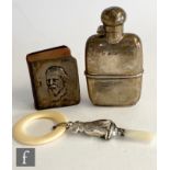 A small hallmarked silver hip flask with a silver fronted leather miniature book of Tennyson's