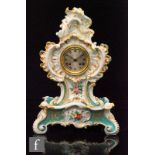A later 20th Century mantel clock decorated with hand painted floral sprays and gilt rococo scrolls,