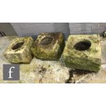 Three Derbyshire stone chimney pots or planter troughs of square form, each approximately 30-32cm
