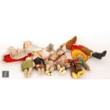 A collection of assorted dolls, comprising a pair of 1920s Bisto Kids dolls with composition heads