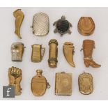 A collection of thirteen novelty brass novelty snuff boxes to include examples formed as a hand, a