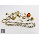 A small parcel lot of assorted jewellery to include a broken 9ct signet ring, three stick pins, a