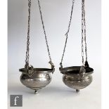 A pair of 19th Century Continental silver hanging oil lamps each of circular form with an engraved