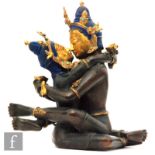 A Sino-Tibetan figure of Mahakala and consort Yab-Yum, the cast metal figures modelled embracing