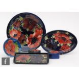 Six pieces of assorted Moorcroft comprising five pieces of Anemone pattern and one Hibiscus, to