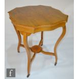 A late Victorian floral marquetry inlaid rosewood centre table, shaped edge top on slender legs