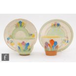 A Clarice Cliff Spring Crocus pattern teacup and saucer together with a Crocus pattern teacup and