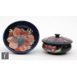 A Moorcroft high sided footed bowl decorated in the Anemone pattern, diameter 14cm, together with