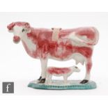 A late 18th to early 19th Century creamware cow creamer and cover with a standing calf beneath,