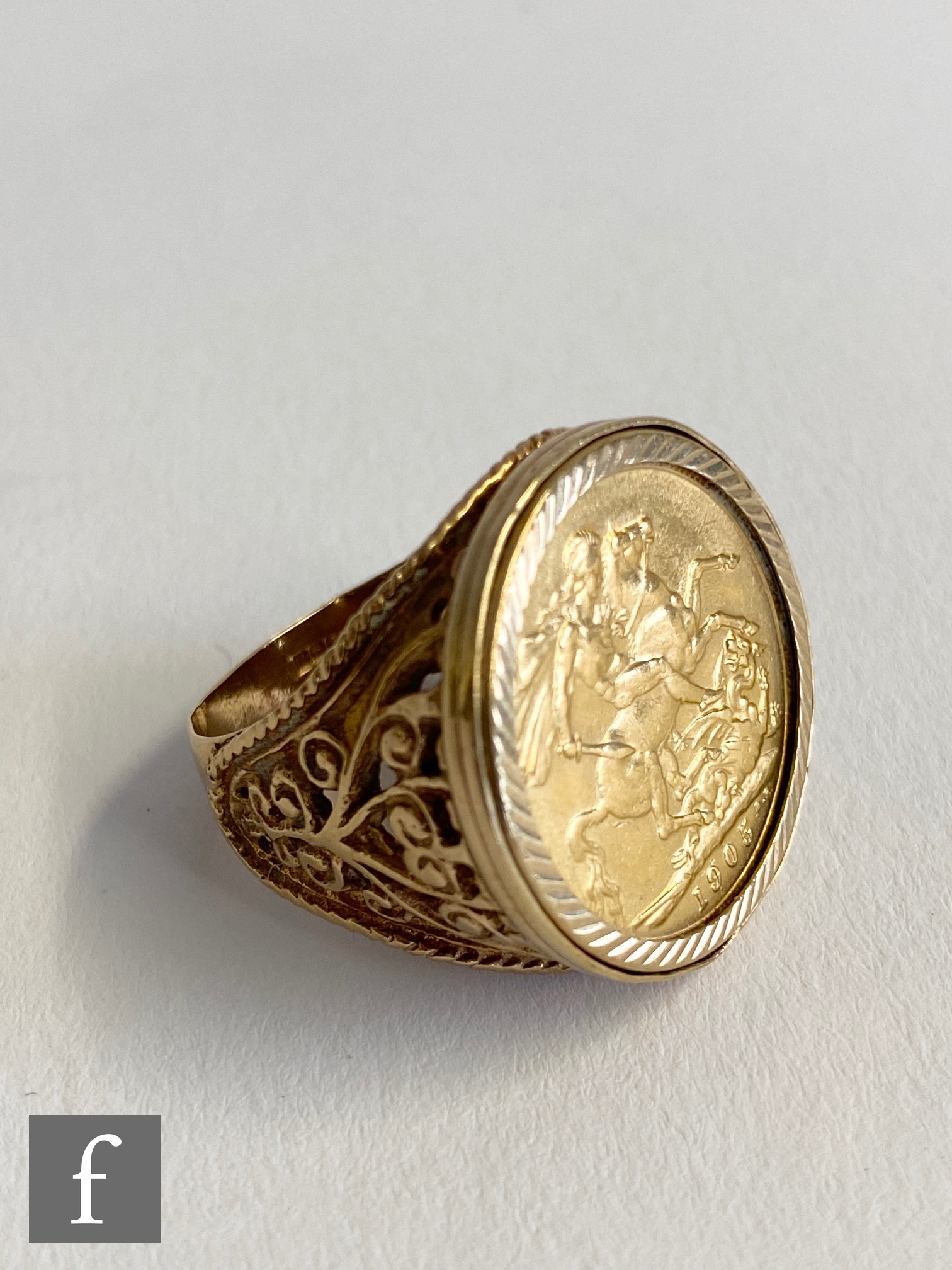 A Edward VII full sovereign dated 1905 loose set to a 9ct ring mount, total weight 16.5g.