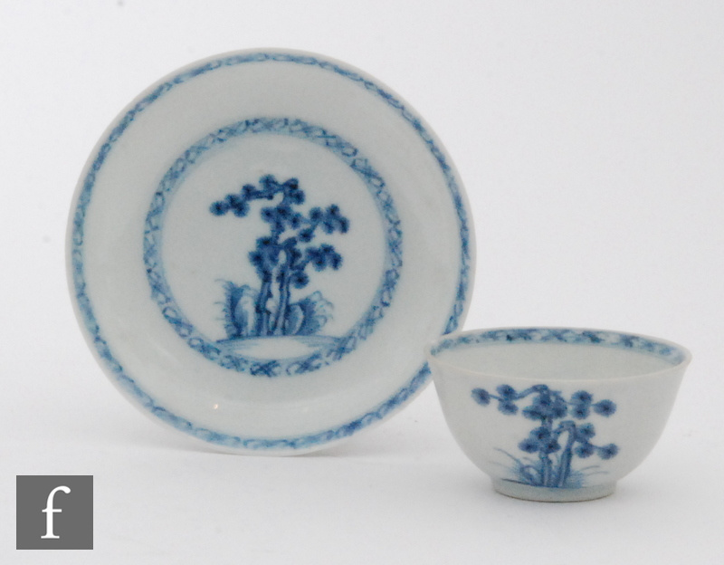 An 18th Century Nanking Cargo teabowl and saucer decorated in blue and white with stylised