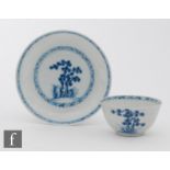An 18th Century Nanking Cargo teabowl and saucer decorated in blue and white with stylised