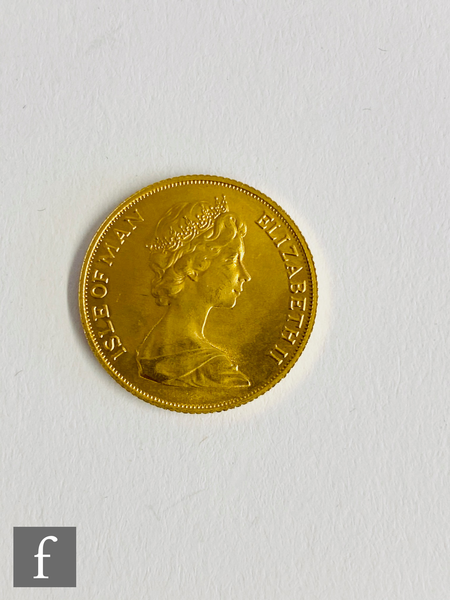 An Elizabeth II Isle of Man sovereign dated 1973.