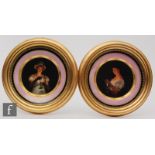 A pair of late 19th Century Vienna type cabinet plates both decorated with hand painted portraits