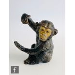 An early 20th Century spelter pocket watch holder modelled as a seated baby chimpanzee , height