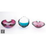 A group of three post war Italian Murano sommerso glass dishes, two of oval section with folded