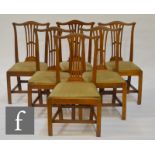 A set of six Georgian style mahogany chairs with pierced sheaf-shaped back splats over drop-in
