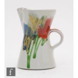 A Dartington studio pottery jug decorated by Janice Tchalenko with patches of coloured glaze,