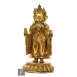 A Sino-Tibetan figure of Amitayus, the copper alloy gilt figure modelled on a lotus plinth base,